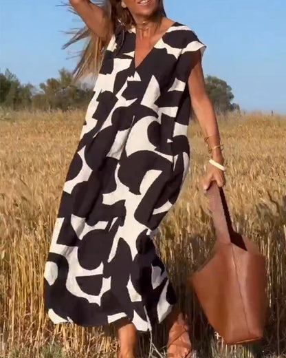 SITA - Dress with print and V-neckline